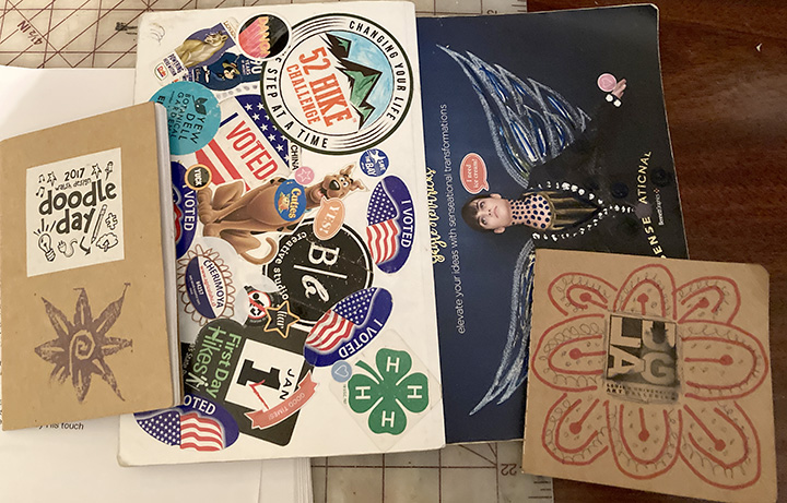 Stack of sketchbooks.